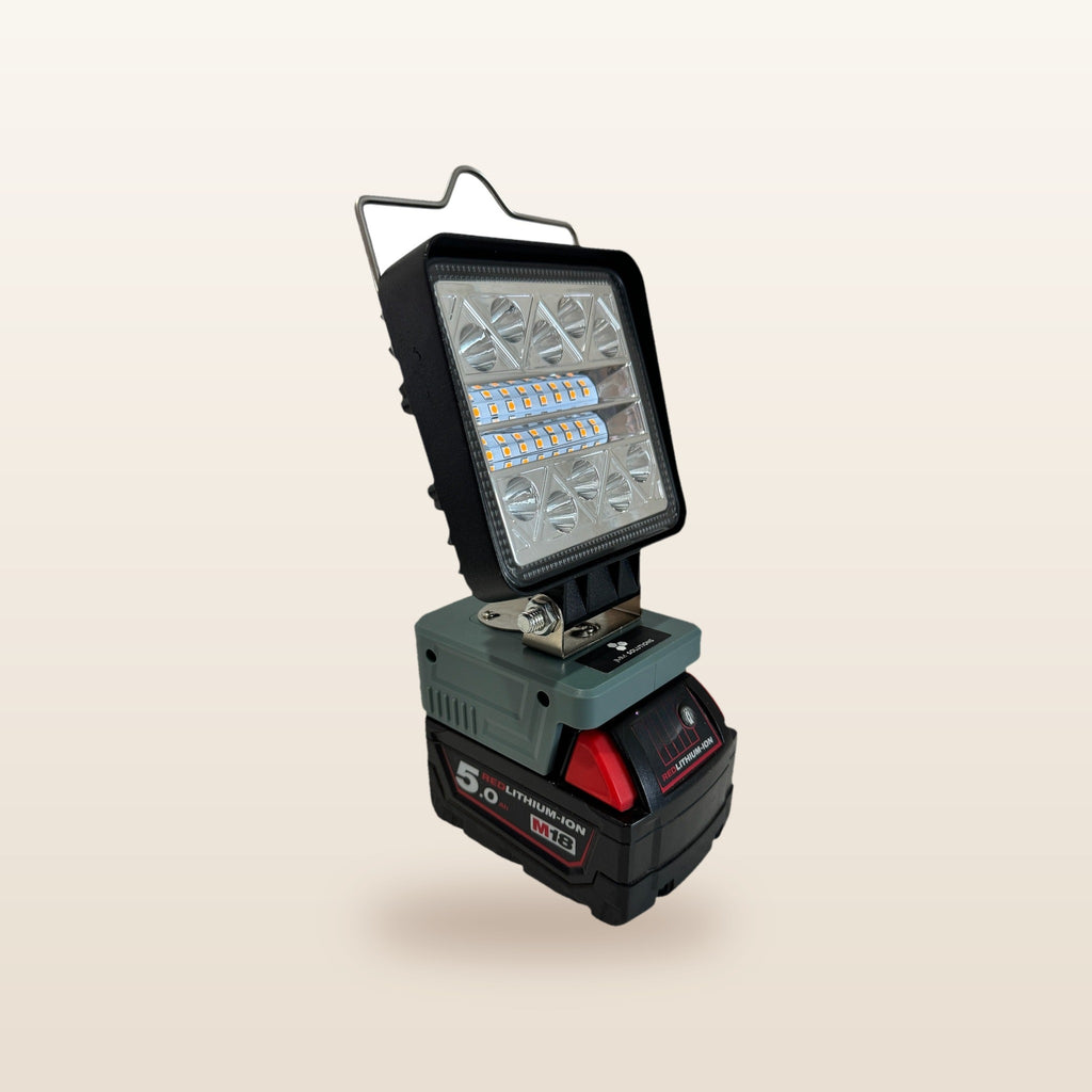 Milwaukee-compatible 18V LED Camp Light: angled view on an 18V battery