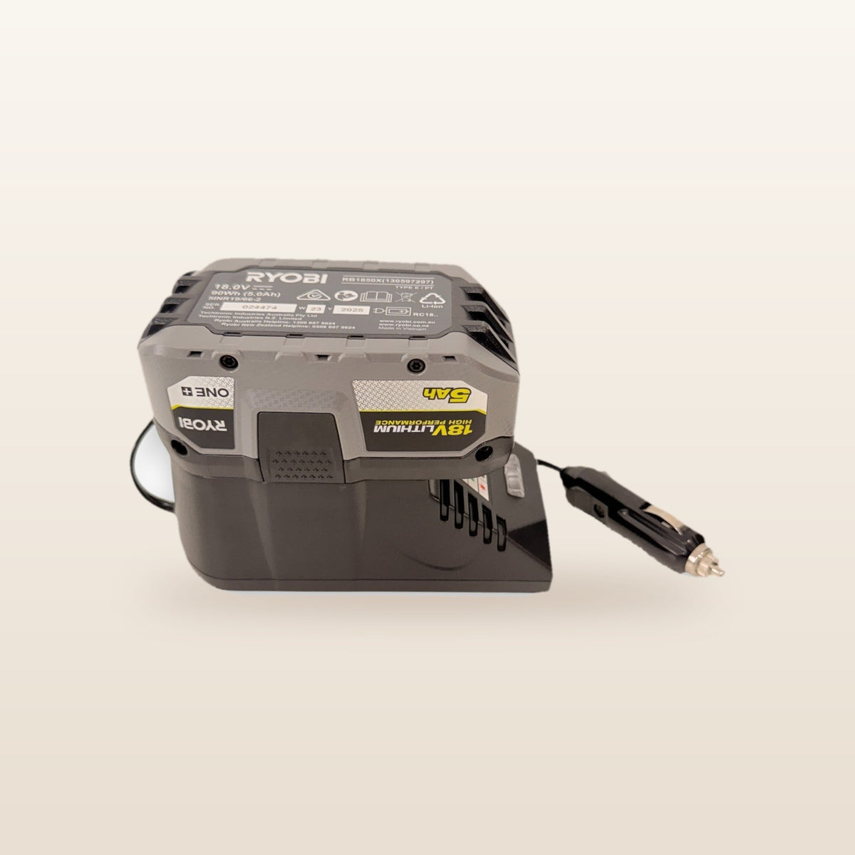 Ryobi ONE+ compatible Volt Step Down PRO + Auto Charger Bundle: front view with battery fitted, showing charge lights