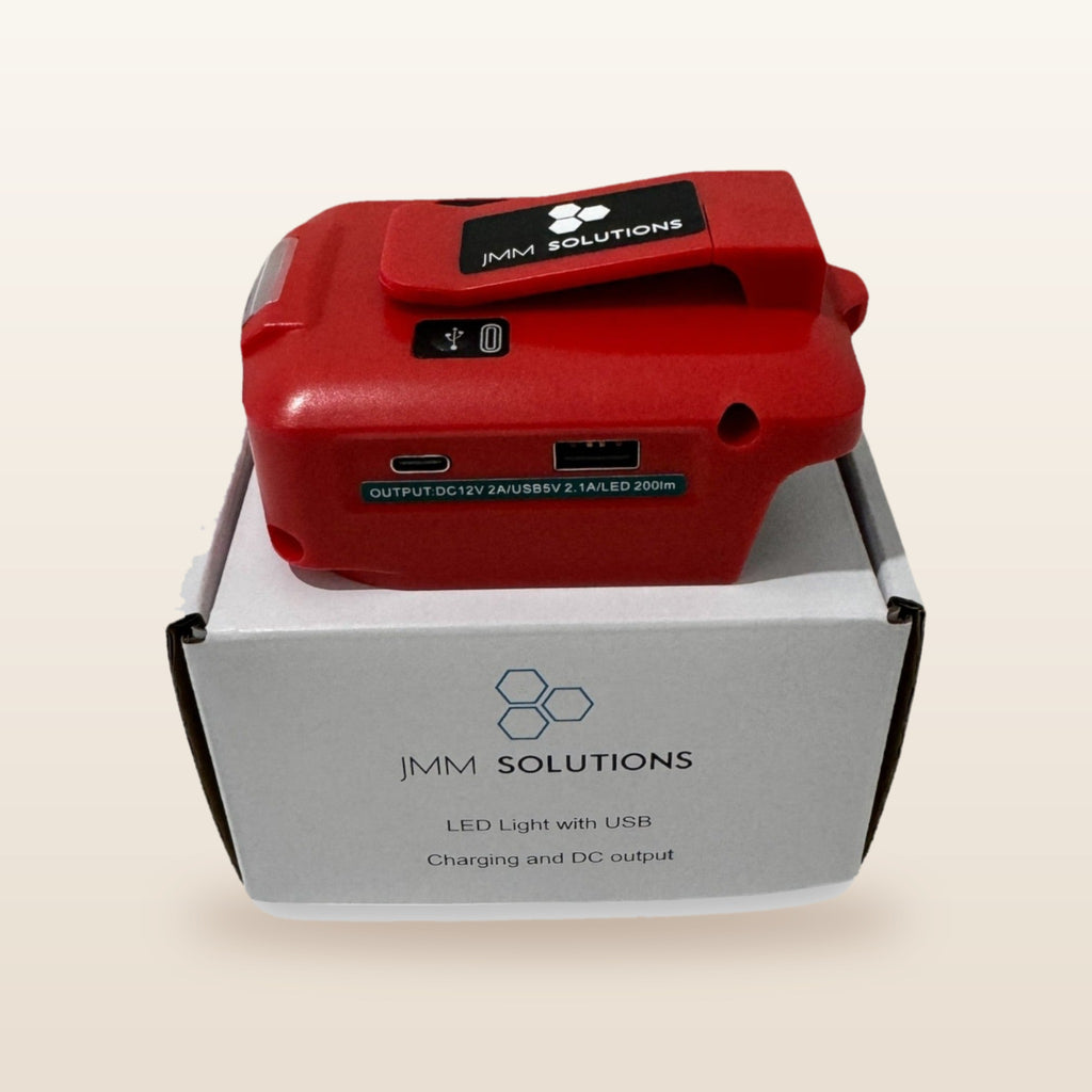 Milwaukee-compatible USB & 12V Charger with LED Light: standing on its box