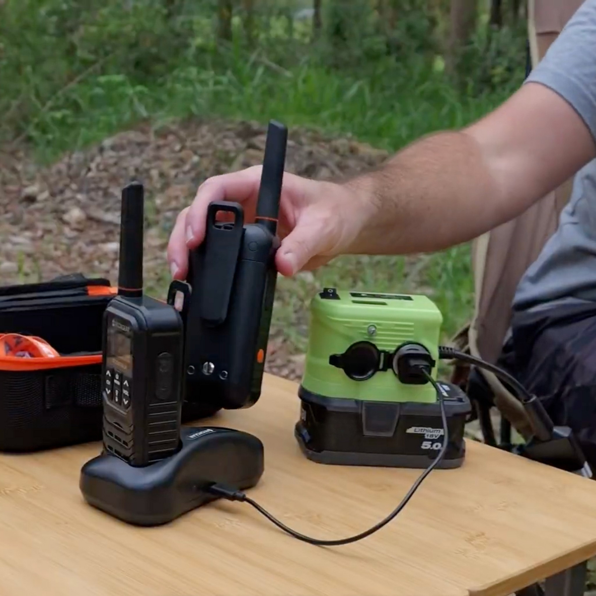 Ryobi ONE+ compatible 18V to 12V Step Down Power Supply: powering a two-way radio charger on a camp table