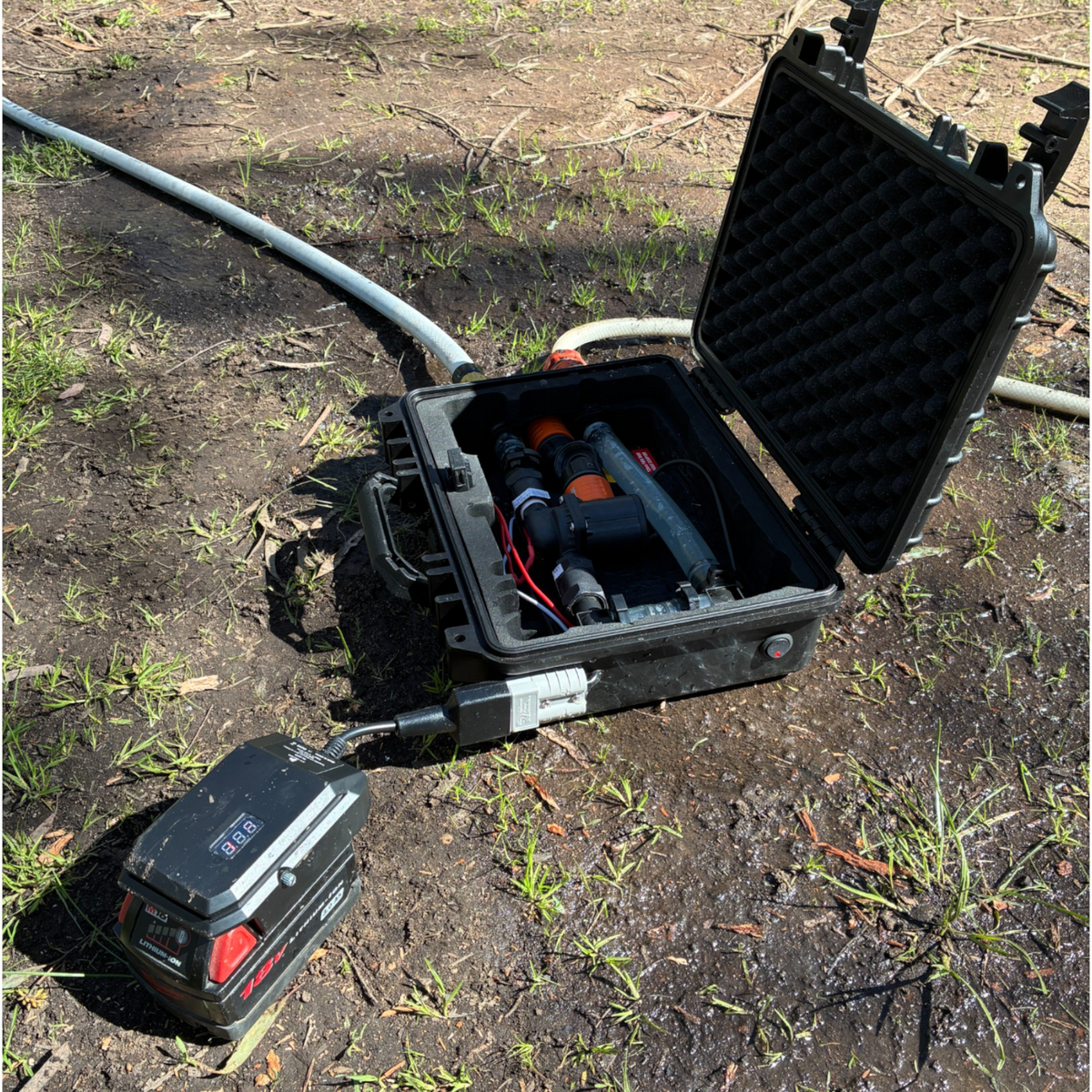 Milwaukee-compatible 18V to 12V Step Down Power Supply: running gear from an open hard case at camp