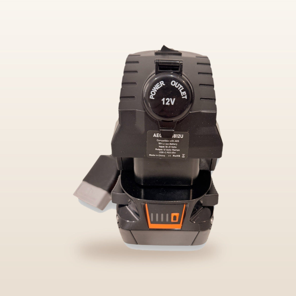 AEG-compatible Volt Step Down PRO + Auto Charger Bundle: front view showing the capped 12V socket