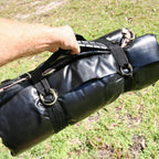 Carrying the rolled Biker Swag by its handle