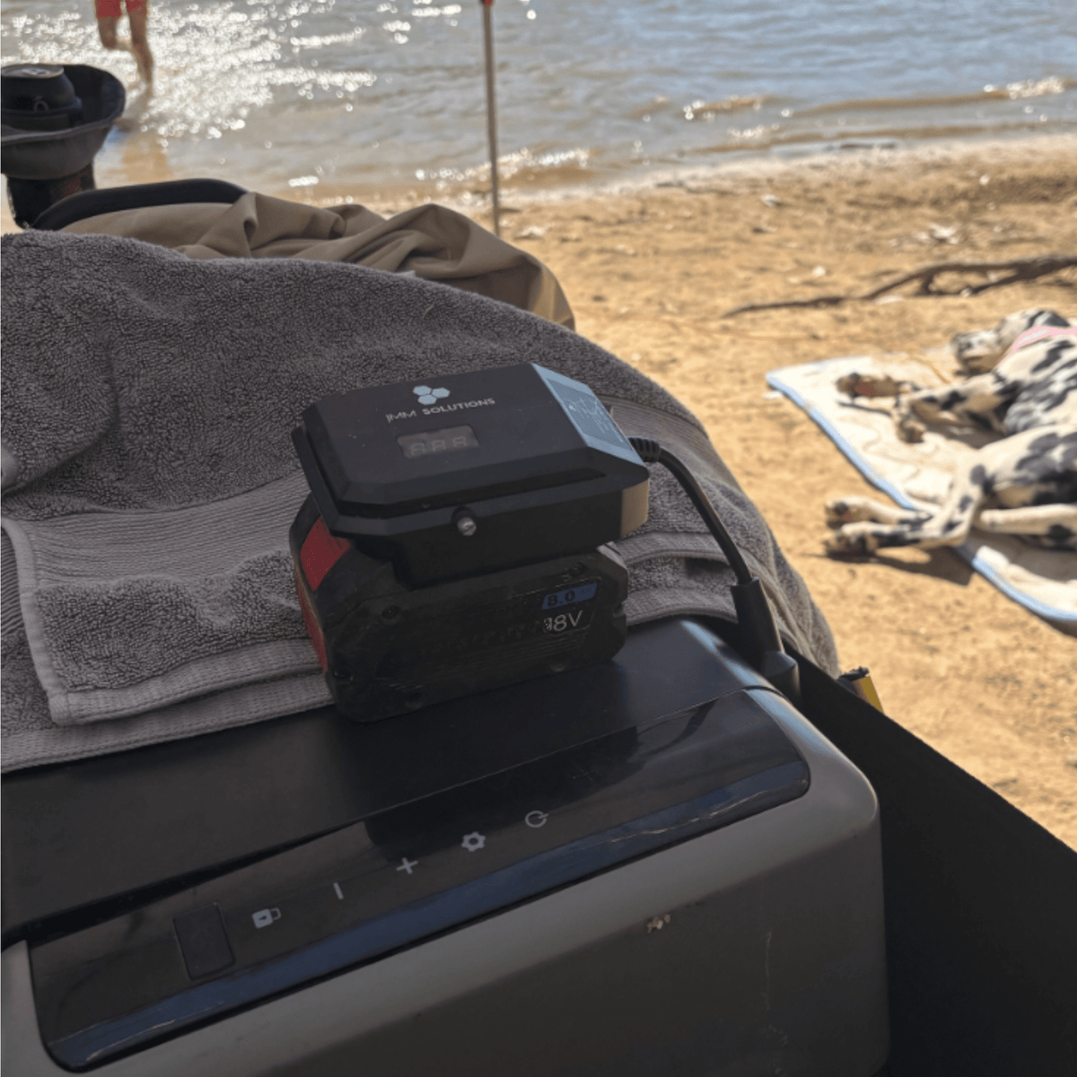 Bosch-compatible 18V to 12V Power Supply + Auto Charger Bundle: in use at a beachside camp
