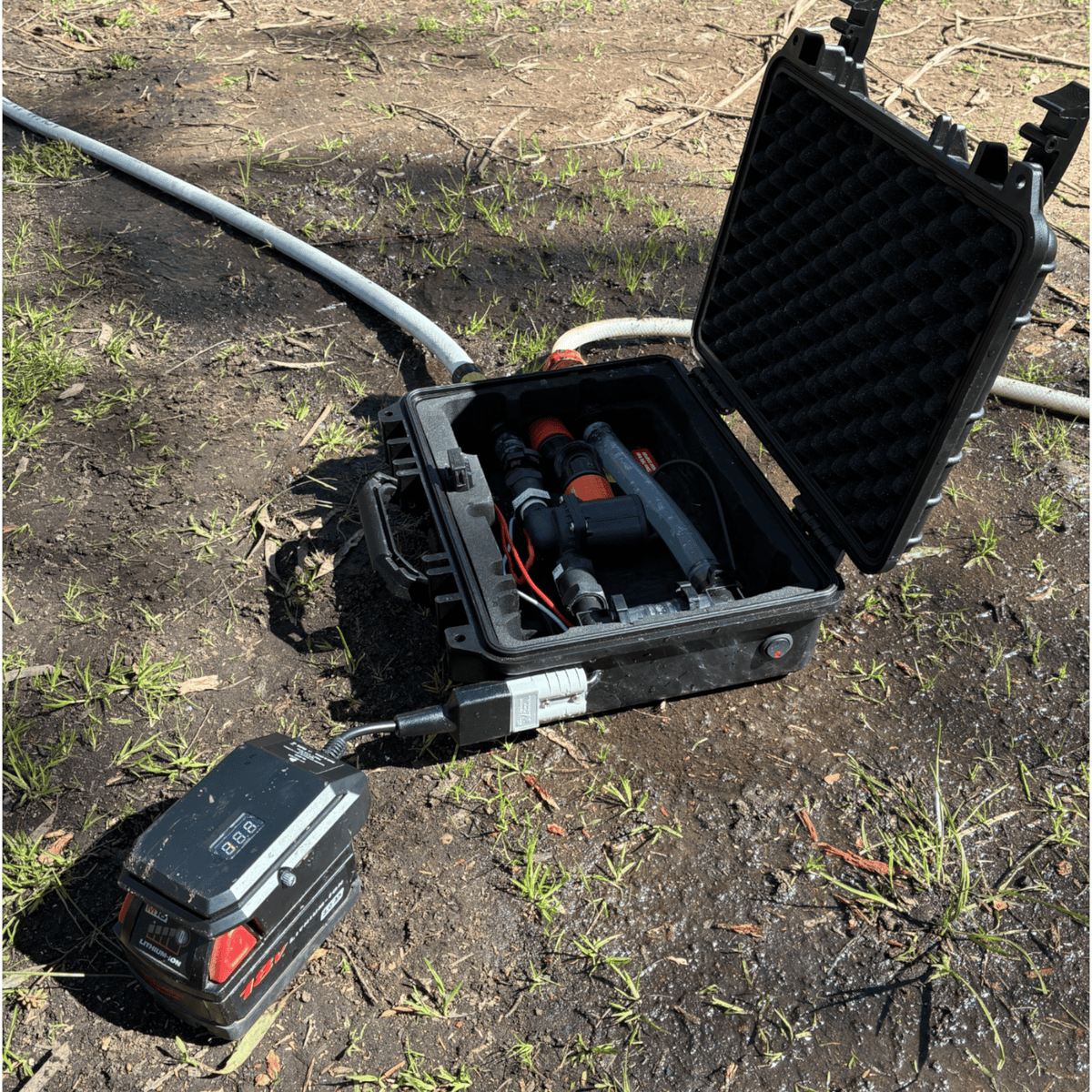 Milwaukee-compatible 18V to 12V Step Down Power Supply: running gear from an open hard case at camp