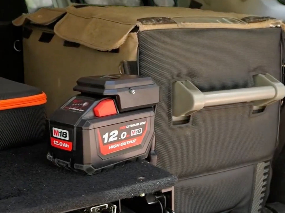 18V to 12V power supply fitted to a Milwaukee M18 battery, running a 12V fridge in the back of a 4WD