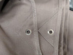 Close-up of the reinforced corner and eyelets on the canvas tarp