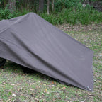 Mr Swagman Premium Canvas Tarp 3m x 3m pitched as a lean-to shelter in the bush