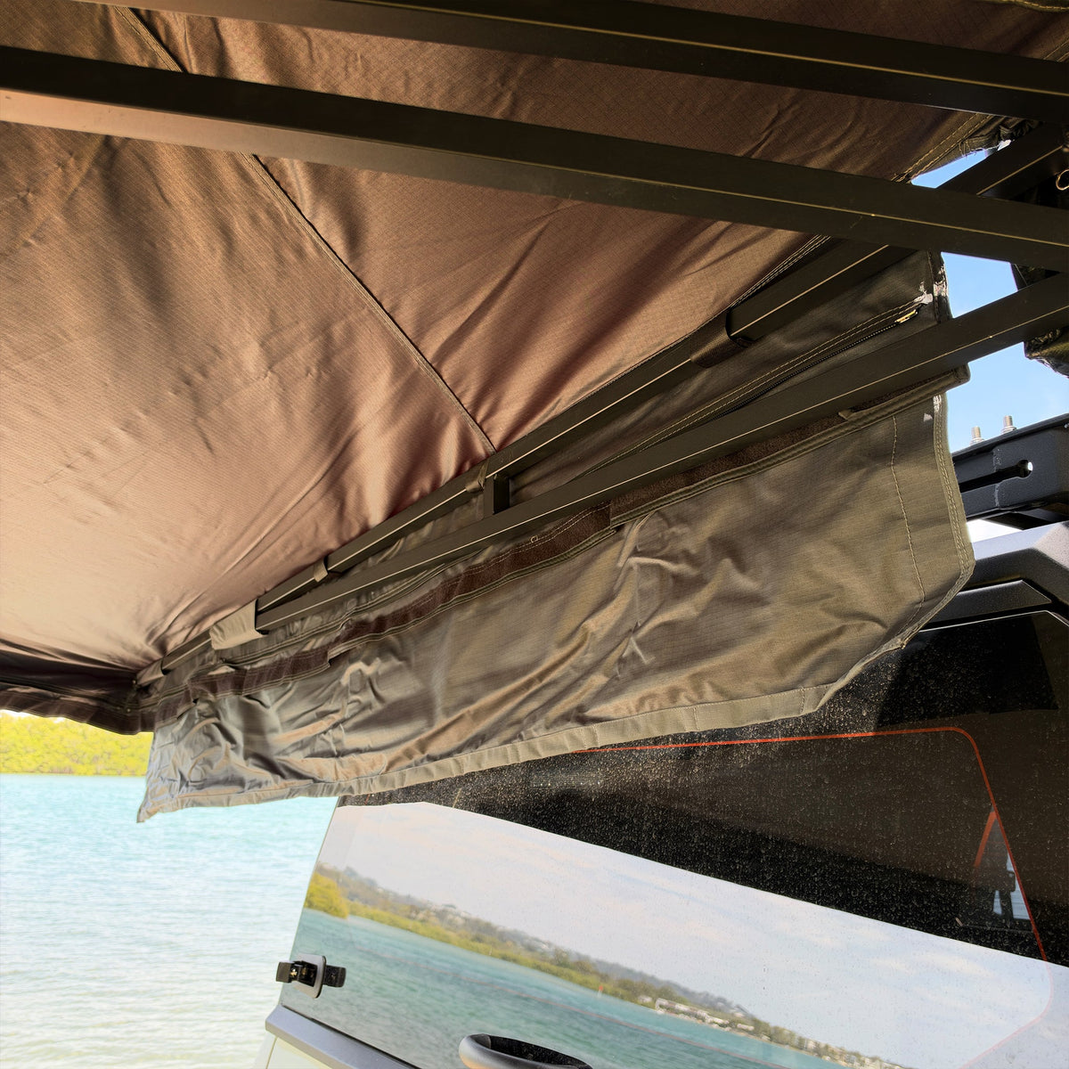 Shelta 270 magnetic weather gutter hanging across the back of the vehicle