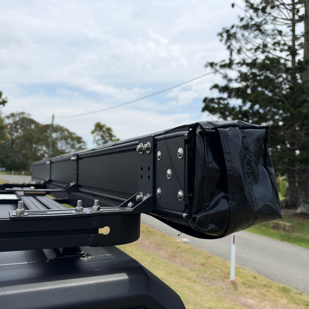 Shelta 270 on a roof rack, showing the hinge end, mounting bracket and PVC cover