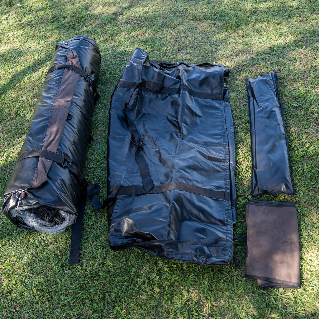 Ultimate King Single Swag packed down: rolled mattress, carry bag and pole bag